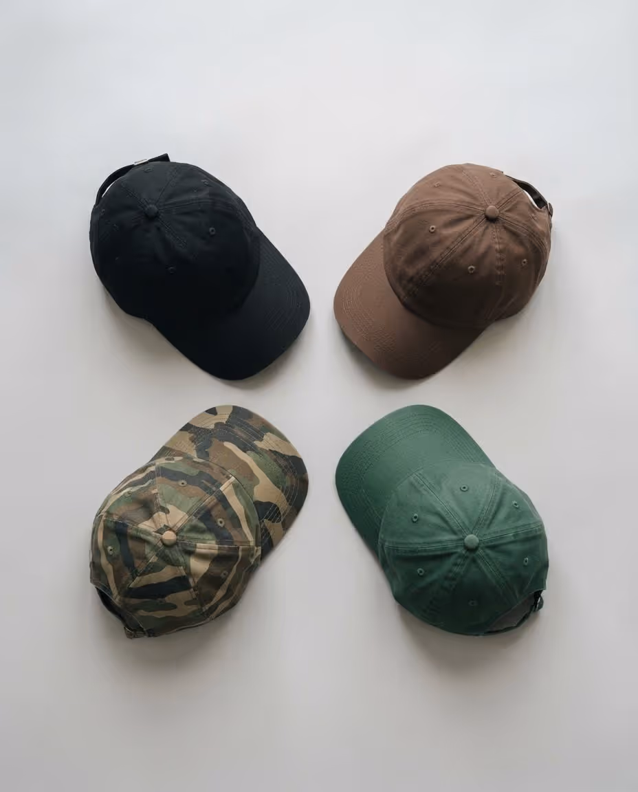 Black, brown, camo and forest green cap blanks photographed from above