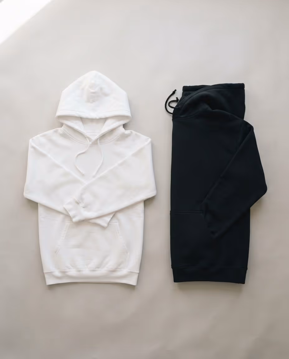 White and black pullover hoodie blanks folded flat
