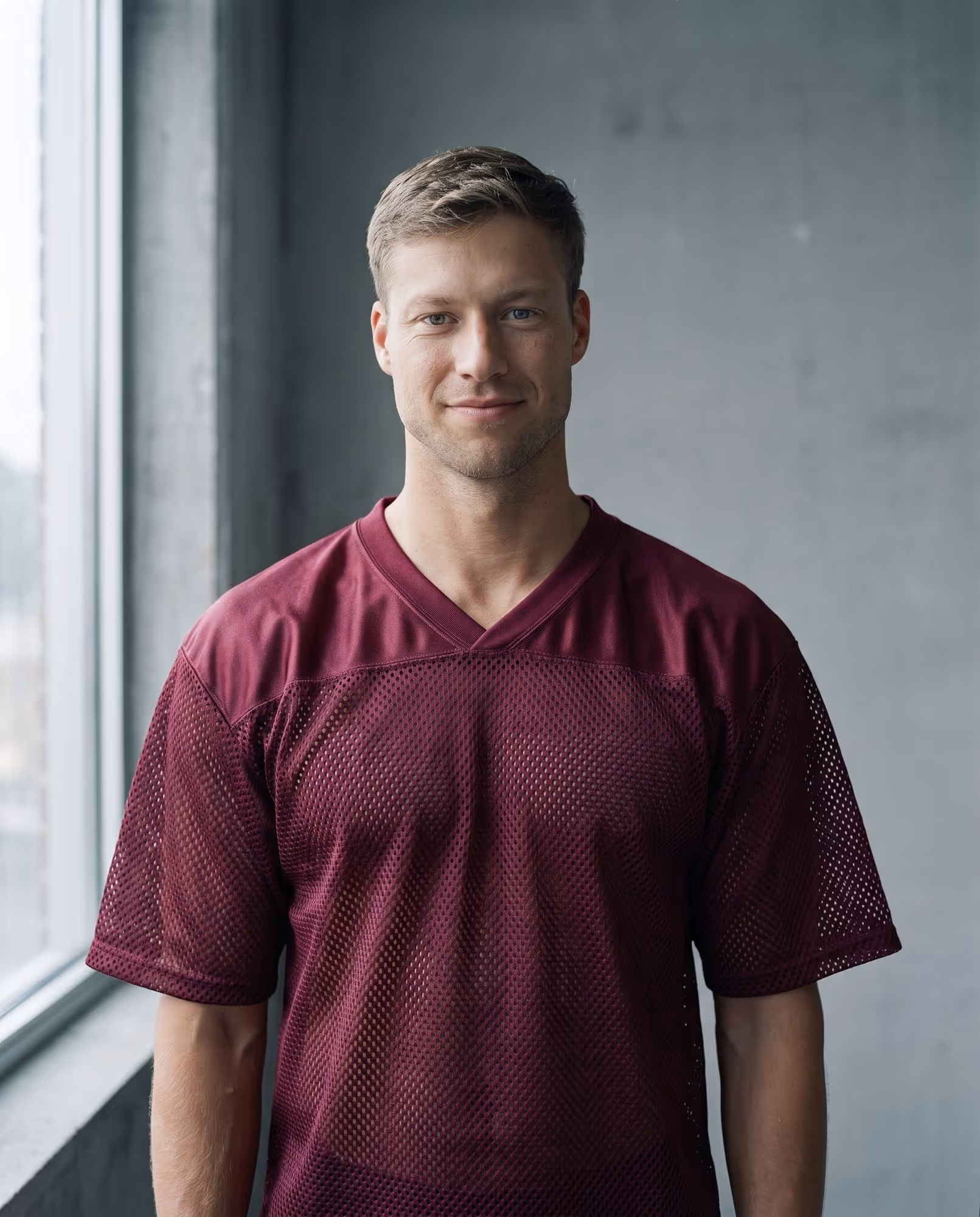Plain maroon mesh football jersey blank with satin yoke, front view