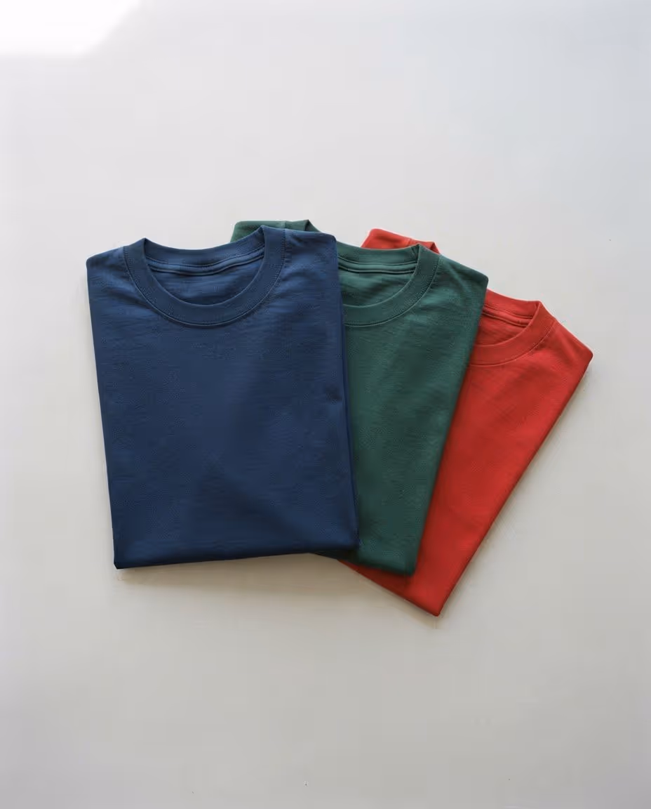 Navy, forest green and red heavyweight cotton t-shirt blanks folded flat